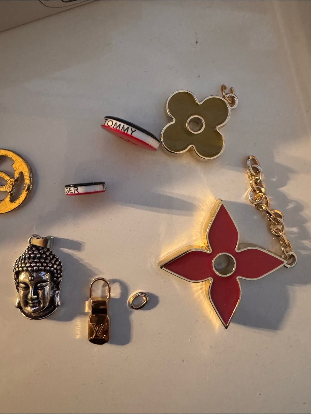 Authentic Tommy Hilfiger, lv and Buddha bundle. Charms, buttons set